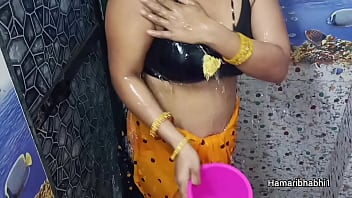 Indian Desi Bhabhi striping sexy yellow saree.